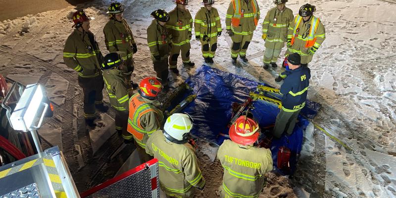 Group of firefighters standing in circle during briefing